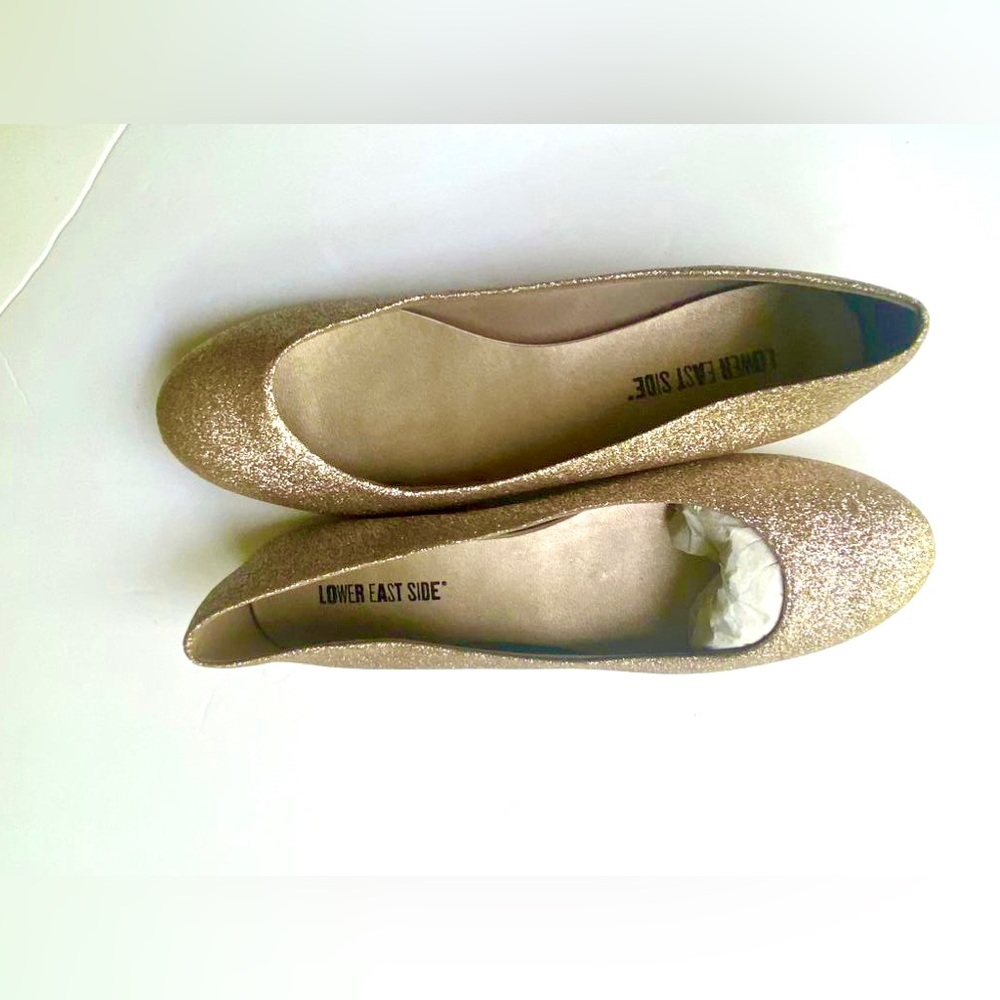 Sparking shining gold flat shoes .